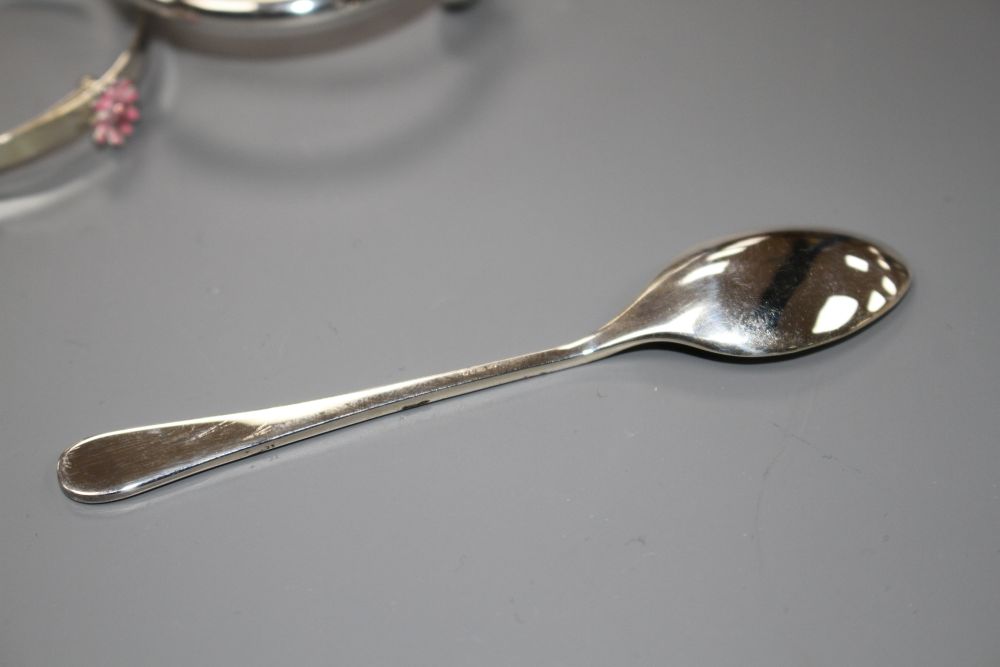 A modern silver coffee spoon and two 925 childs bangles, gross weight 31 grams.